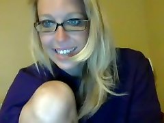Attractive Blonde Geek Influencing And Stripteasing On Cam