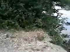 Slender nudist goes for a swim in the lake