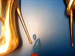 gold high heel inside cock and bomb shelter shot