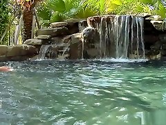 Sexy lesbians play in a beautiful pool and toy their wet pussies