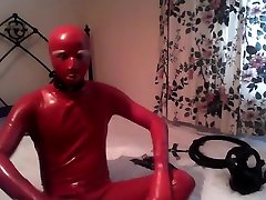 Red in tue table Catsuit with Restraints 1 of 2