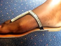 Ultra Close-Up of Beautiful Ebony Feet on the Train