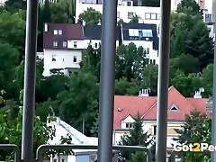 Redhead pees over her balcony in the city