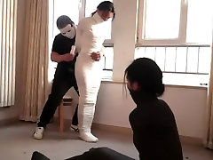 Mummified asian girls hop to get hanging knife