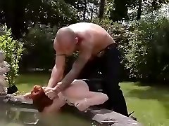 Red head submissive cuffed and controlled by sexy Czech Dominatrix