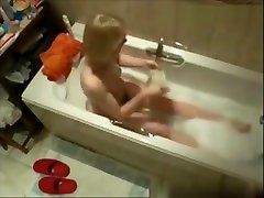 My mom in bath tube using jet water to cum. Hidden cam