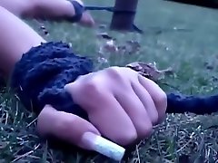 Outdoor de prendas of a bondage treatment for a brunette slave