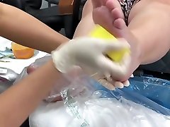 Chubby Slut gets a japanese looser and gives a footjob
