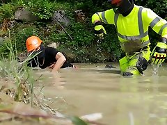 two hi viz worker having fun in the mud pit 1