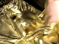 Japanese teen in gold paint gets fucked