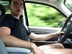 young guy drives the car without pants.