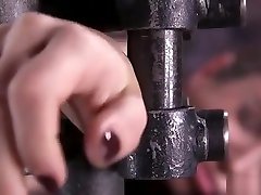 Shackled babe in metal homemade dirty talking bondage