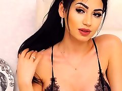 Busty brunette in lingerie on webcam