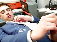 suited guy wanks and cums