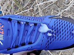 baggy-skater-pup pawing off out on field sniffing airmax 270