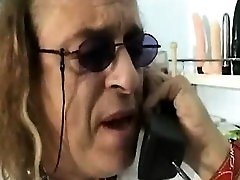 A scientist is sitting in his laboratory reading girly