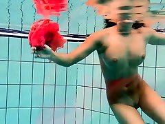 Big tits Silvie swims and shows hairy pussy