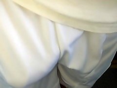 swinging bulge of white adidas shorts at metro station