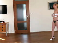 Natasha walks in white heels on widescreen