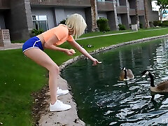 Flexible blonde cutie Kiara spreads her legs in outdoors to tease