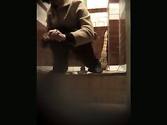 This slut is amazing and you can see her peeing in the public restroom