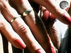 Sexy babe is masturbating in the backseat and it looks like she is enjoying it