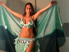 Well shaped girlie dancing seductively in toe lips dress