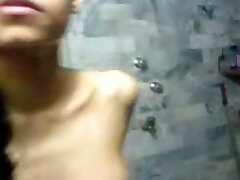 Lean and sexy dark skin Indian teen babe showering on cam