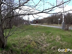 Redhead white girl walking outdoors needs to pee real bad