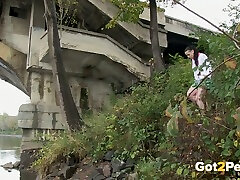 Long haired desperate amateur brunette pisses under the bridge