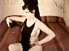 Busty brunette undresses and shows her hairy snatch