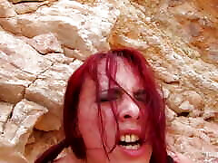 One lucky beachgoer gets to be rough with the redhead that